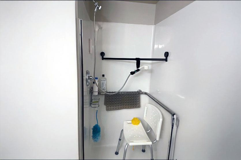 The Aide-ing Arm Mini shower chair attachment